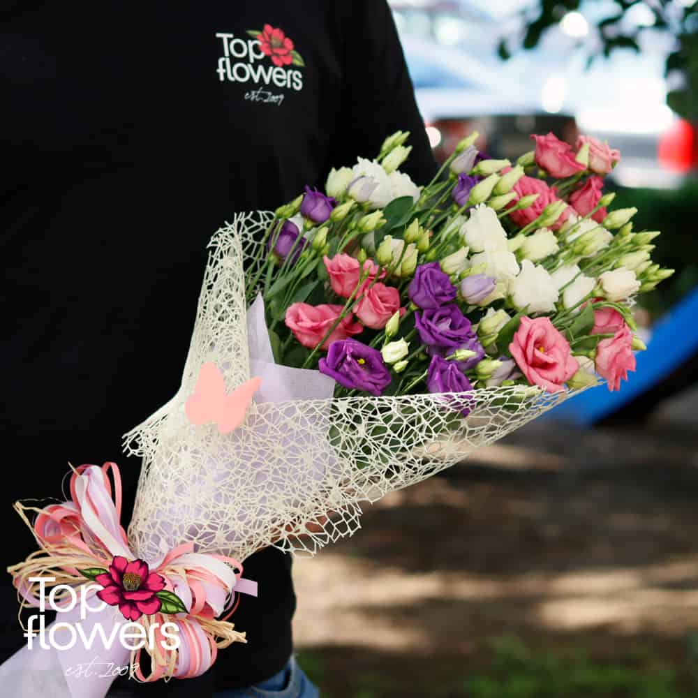 Premium Photo  Beautiful delicate pink flower bouquet of white roses and  eustoma in a beautiful package