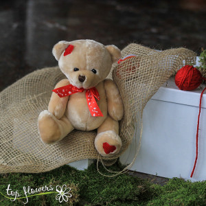 Teddy bear with red ribbon Beige | 20 cm.