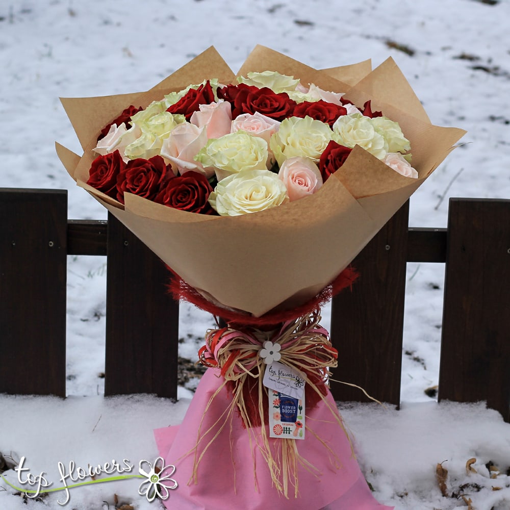 Round bouquet of 31 Red, White and Pink Roses