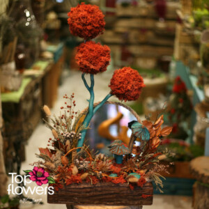 Decorative composition with moss and a round mirror from a flower shop