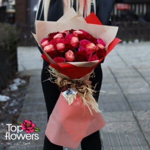 31 red, cyclamen, and peach roses | Bouquet