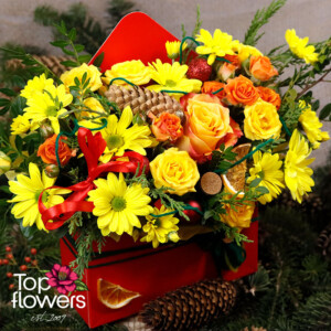 Detail from the “Flame of Christmas” arrangement with red ribbon and yellow blooms