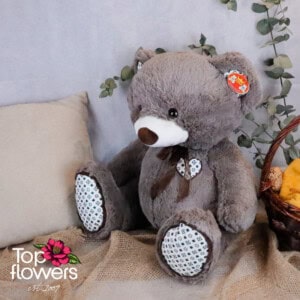 Bear with bow and appliquéd heart in grey | 50 cm.