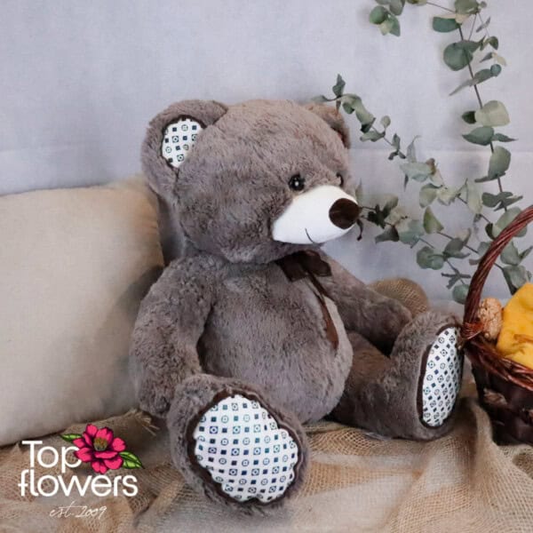 Bear with bow and appliquéd heart in grey | 50 cm.