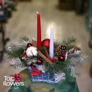 Christmas composition in a decorative basket from a flower shop