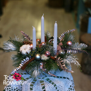 Art installation Silent Christmas with three candles and Christmas decorations