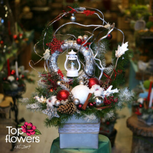 Handcrafted Christmas composition with moss and a ceramic pot