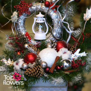 Art Installation | Light in the Winter Night Detail of a winter art installation with pine cones and festive elements