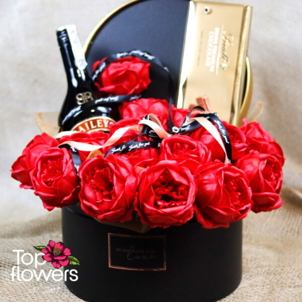 Gift box with liqueur, chocolate, and soap flowers