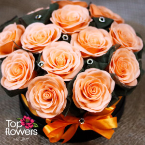 Luxury box with peach-colored soap roses and decorative ribbon