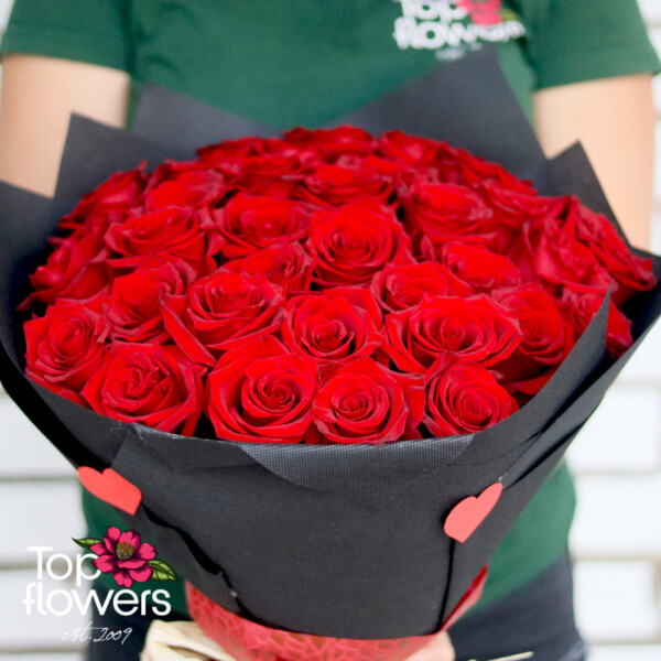 Modern red rose bouquet held in hand