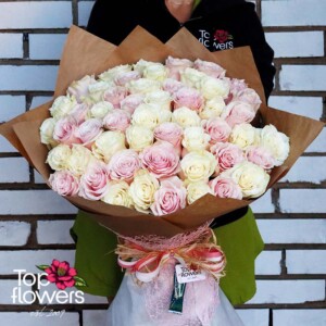 Bouquet of 51 white and pink roses, wrapped with natural materials
