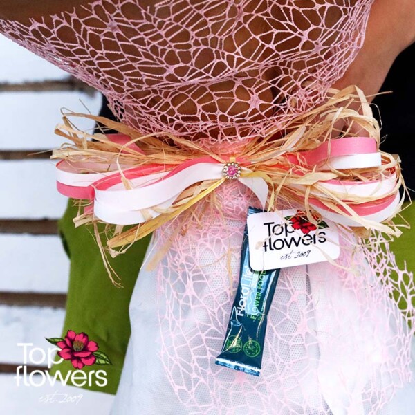 Detail of ribbon and wrapping in bouquet “51 White and Pink Roses”