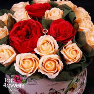 Arrangement with soap roses in red and cream colors