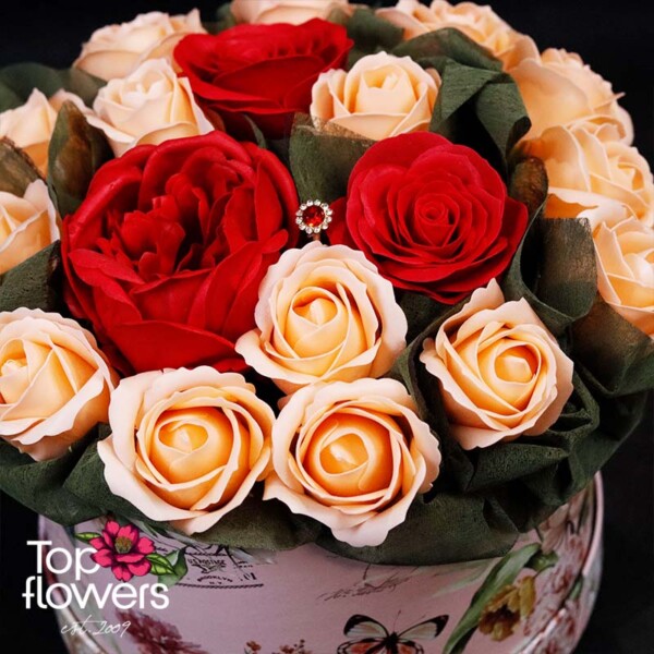 Arrangement with soap roses in red and cream colors