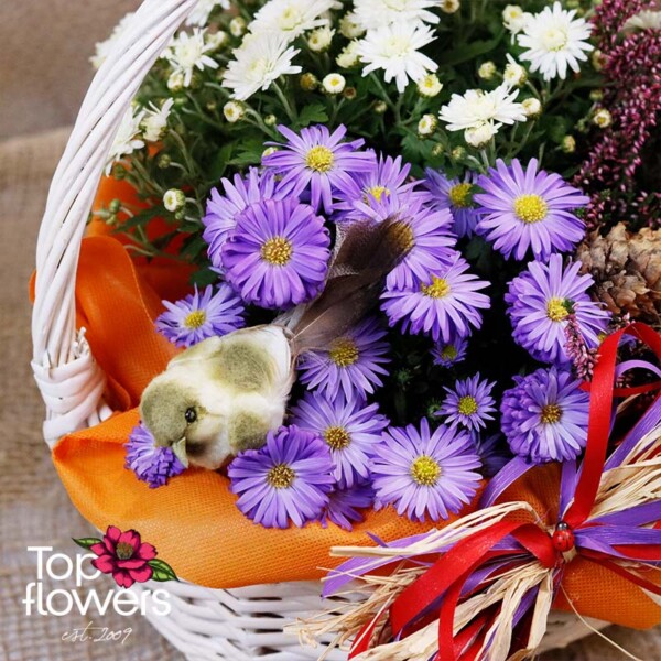 Detail of basket with heather, asters, and colorful decorative accents