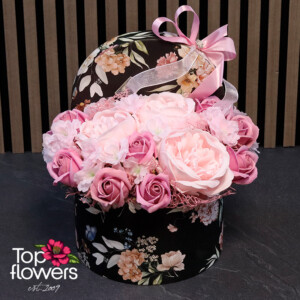 Elegant arrangement of soap roses in a decorative box with a floral pattern.