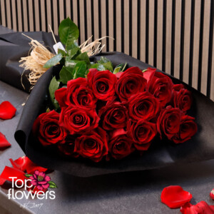 Bouquet of Red Explorer Roses in black wrapping