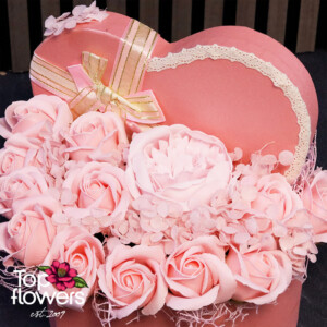 Elegant heart-shaped gift box decorated with a satin ribbon and premium soap roses.