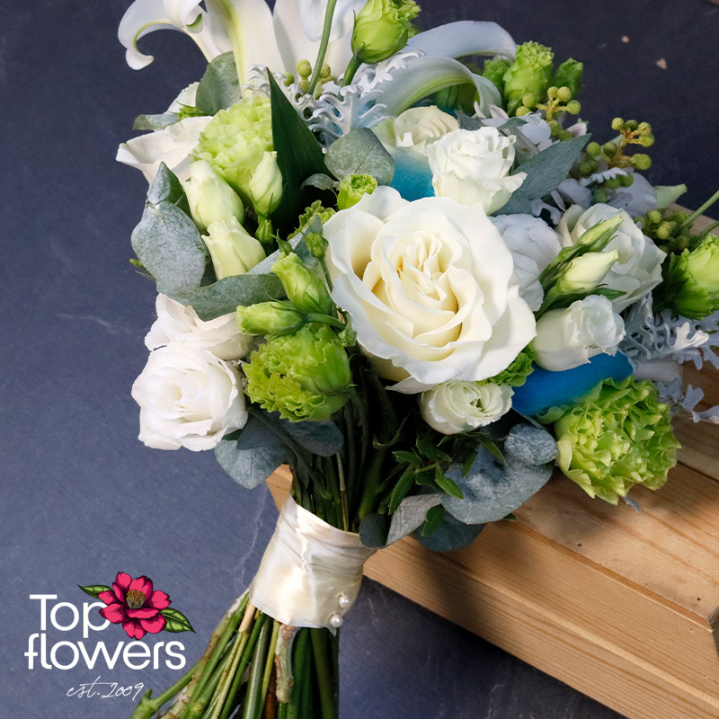 Elegant Oceana bridal bouquet with white flowers, eucalyptus, and senecio